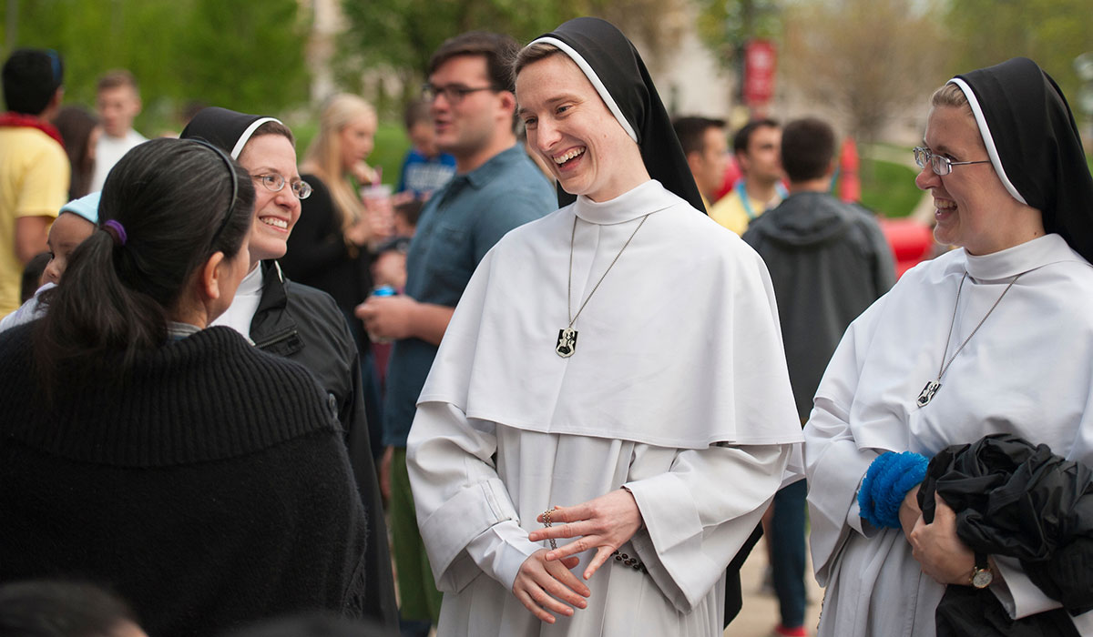 Nuns talking to student