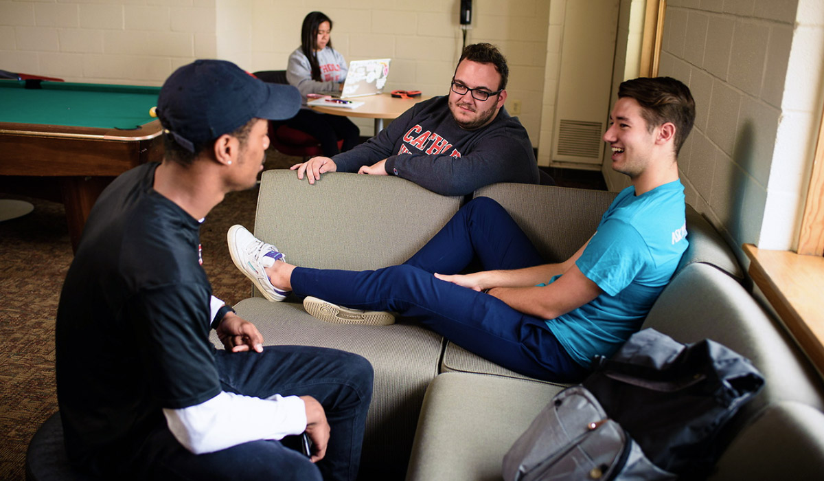 student in residence hall lounge