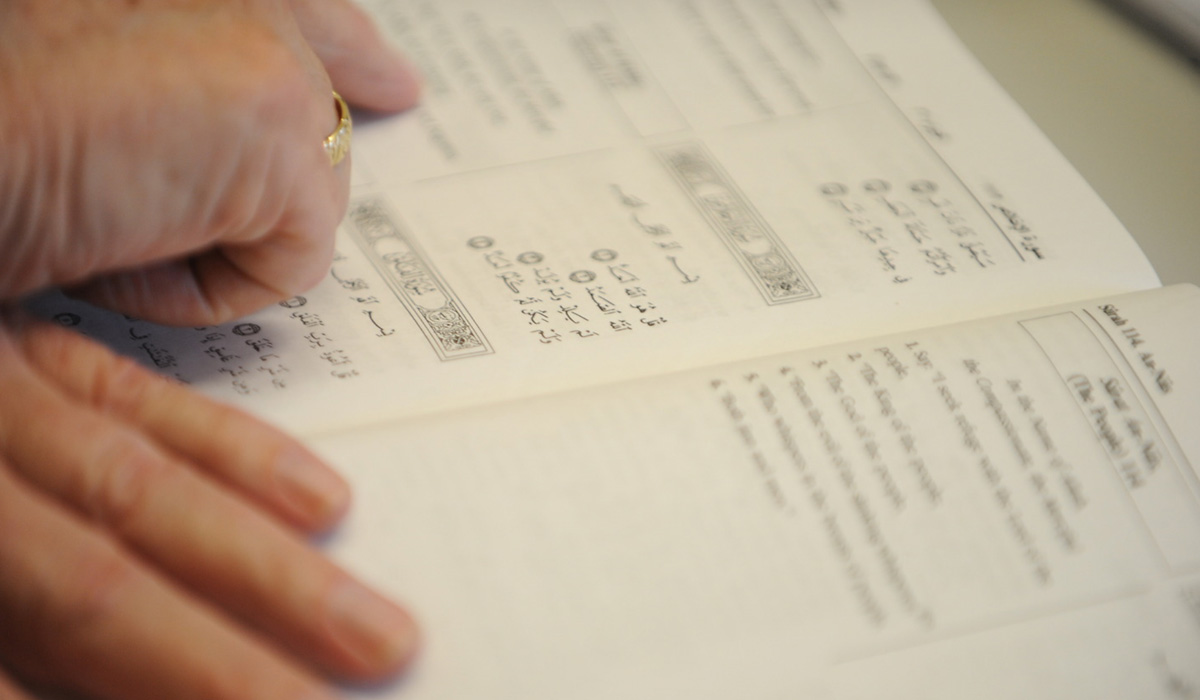 person reading religious book