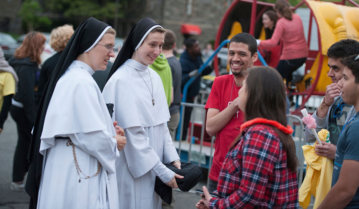 Sisters talking to students